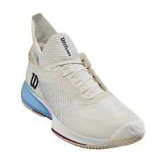 a white tennis shoe with blue accents on the side and bottom part of the shoe