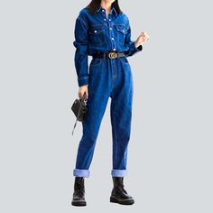 Revive the iconic fashion of the Y2K era with our 2023 Spring-Summer Collection's women's denim jumpsuit! Featuring a sanded medium wash. slim fit. and buttoned closure. this millennial-inspired jumpsuit will take your style game to the next level.Why You'll Fall In LoveThis timeless piece is sure to bring you endless compliments. with its carefully crafted silhouette. vibrant painted prints. and its unique sanded texture. Whether you're out for a picnic. rooftop gathering. or a special evening Spring Denim Blue Button-up Overalls, Trendy Relaxed Fit Medium Wash Denim Jumpsuit, Dark Wash Relaxed Fit Denim Jumpsuit With Button Closure, Casual Button-up Denim Jumpsuit, Casual Medium Wash Button-up Denim Jumpsuit, Denim Blue Button-up Jumpsuit With Relaxed Fit, Trendy Button-up Denim Jumpsuit With Pockets, Denim Blue Button-up Jumpsuit, Denim Blue Button-up Relaxed Fit Jumpsuits And Rompers