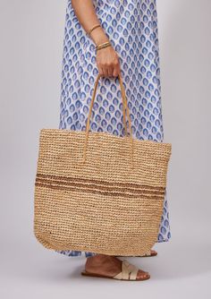 Our classic Luxe Striped Tote with black stripes is sure to brighten up your spring and summer! Packable for easy travel and roomie for all of your goodies. Optional leather loop to hold your favorite sunhat! Shop Black Material: 100% Raffia Straw, Handles- 100% Leather Measurements: 19" x 14"; Handle Drop- 9" Spot Cle Casual Striped Vacation Bags, Casual Striped Bags For Vacation, Casual Striped Rectangular Straw Bag, Casual Striped Rectangular Beach Bag, Casual Striped Beach Bag For Vacation, Striped Summer Style Bag, Casual Striped Straw Bag, Casual Striped Woven Bag, Casual Striped Straw Bag For Beach