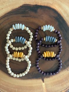 "I love adding in a little something different to my bracelet stacks! These are perfect for that!  This listing is for ONE wooden beaded bracelet with Ashanti glass beads in mustard, slate, or dark purple. The two wood tone choices are natural or dark chocolate brown. (Only one available for each at this time) Wear alone, wear multiples, or add to another stack for a fun combination! The possibilities for this chunky neutral bracelet are endless!   The bracelets are 7\", which fits average adult Bohemian Stretch Bracelet With Large Beads For Everyday, Bohemian Beaded Stretch Bracelet For Everyday, Bohemian Wooden Beads Stretch Bracelet, Bohemian Stretch Bracelet For Everyday, Bohemian Bracelet With Round Wooden Beads, Adjustable Bohemian Stretch Bracelet With Wooden Beads, Bohemian Stretch Bracelet With Colorful Beads For Meditation, Unique Wooden Beaded Bracelets For Healing, Unique Wooden Beads Bracelet For Healing