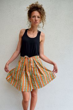 "High waist summer skorts, 60s 70s bohemian shorts, striped hippie shorts, festival wear, M 100% cotton high waist summer skorts. Two side pockets and one more on the bottom. Thick and strong fabric. Size: seems like women's (M) PLEASE CHECK ALL MEASUREMENTS BELLOW: Length: 50cm / 20\" Waist: 70 cm / 28\" Hips: 170 cm / 67\" Inseam: 16 cm / 6\" Fabric: 100% cotton Brand: Mexx Condition: excellent * Wash at temperature not higher than 30oC / 86oF KEEP IN MIND: Photo might be slightly different fr Retro Summer Shorts, Summer Festival Mini Skirt, Summer Striped Cotton Skirt, Striped Cotton Skirt For Summer, Bohemian Mini Shorts For The Beach, Casual Striped Mini Skirt For Summer, Orange Mini Skirt For Summer Beach, Orange Mini Skirt For Beach In Summer, Bohemian Mini Length Beach Shorts