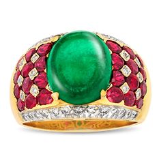 A mesmerizing cabochon emerald weighing 5.50 carats exhibits a deep green hue in this bombe-style ring. The domed bombe form is crafted of 18K yellow gold and is set with rich rubies totaling 2.50 carats and sparkling diamonds totaling approximately 0.40 carat. Golconda Diamond, Colombian Emerald Ring, Ruby And Diamond Ring, Platinum Diamond Rings, Colombian Emeralds, Green Gems, Cabochon Ring, 18k Yellow Gold Ring, Emerald Jewelry