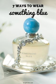 a bottle of something blue sitting on top of a plate with the words, 7 ways to wear something blue