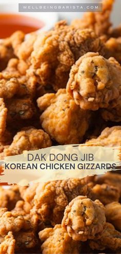 fried chicken is piled on top of each other with the words, dak dong jib korean chicken gizzards