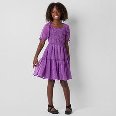 This Thereabouts little and big girls' dress boasts a smocked bodice that offers a comfortable fit and an A-line silhouette making it ideal for twirling. Made from lightweight georgette, it also features a square neck, short puffed sleeves, and a knee-length. Style it with sneakers for a cute and casual outfit. Closure Type: Pullover HeadNeckline: Square NeckSleeve Length: Short SleeveDress Length: Knee LengthFiber Content: 100% PolyesterFabric Description: GeorgetteCare: Tumble Dry, Machine Was A Line Dresses, Dress Purple, Plus Dresses, Puffed Sleeves, Girls Dress, Short Girls, Purple Dress, Casual Outfit, Square Neck