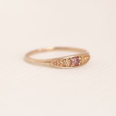 Fine Jewelry Birthstone Flower Promise Ring, Heirloom Pink Sapphire Ring, Delicate Flower Birthstone Promise Ring, Sapphire Birthstone Open Ring For Promise, Promise Sapphire Open Ring Birthstone, Recycled Gold Birthstone Ring Jewelry, Promise Sapphire Ring With Birthstone In Open Shape, Delicate Yellow Gold Birth Flower Rings, 14k Gold Promise Crystal Ring With Birthstone