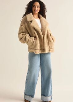 Wrap yourself in comfort with this jacket, made from plush short-haired sherpa jacket accented with faux leather trim details. Featuring a collared, button front design and pockets, combining a classic cozy feel with modern style. Collared. Long sleeve. Button front. Flap pocket. Heavyweight Plush sherpa. Regular fit. Short Haired Faux Sherpa: 100% Polyester. Faux leather trim detail. Model is wearing a size S. Beige Sherpa Outerwear With Faux Fur Lining, Winter Outerwear With Faux Fur Lining And Lapel Collar, Fall Faux Fur Coat With Fleece Lining, Trendy Fur Coat With Pockets For Cold Weather, Chic Collared Outerwear With Faux Pockets, Faux Fur Lined Sherpa Coat, Sherpa Fur Coat With Faux Fur Lining, Cozy Fall Outerwear With Faux Fur Trim, Cozy Outerwear With Faux Fur Lining For Fall