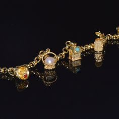 Etruscan Italian Fratelli Chini / Ponzzali 18k Solid Gold Gemstones Charm Bracelet. This Bracelet Already Has Five Magnificent Multi-Color Gemstone Studded Charms. There Is Plenty Of Space To Add More Charms If Desired. This Bracelet Has A Stunning Smooth / High Shine Rolo Links Chain Design. Extremely Durable Solid Gold Bracelet. This Bracelet Closes With A Lobster Clasp, So Its Very Secure And Safe To Wear. The Five Charms Are Meticulously Made With Attention To Fine Details Throughout. The Charms Feature Multiple Gemstones, Textures, Beaded, Twisted Wire And Engraving Work In Solid 18k Yellow Gold. The Charms And The Bracelet Have A Slight Patina. This Patina Looks Amazing, Since It High Gold Italian Charm Bracelet, Italian Charm Bracelets, Pearl Charm Bracelet, Solid Gold Bracelet, Twisted Wire, Chain Design, Gemstone Studs, Pearl Charms, Italian Charm Bracelet