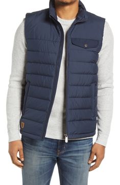 The layering possibilities are endless with this versatile down vest that offers tons of warmth and powerful protection against the elements. 26 1/2" length (size Medium) Lined, with down fill 100% polyester Machine wash, tumble dry Imported Nylon Hiking Vest For Fall, Fall Hiking Nylon Vest, Sleeveless Down Puffer Jacket, Outdoor Puffer Vest Jacket Sleeveless, Sleeveless Down Puffer Jacket For Cold Weather, Winter Outdoor Down Vest, Outdoor Quilted Down Vest, Functional Sleeveless Down Outerwear, Outdoor Puffer Vest With Down Filling