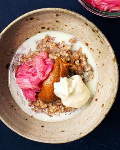 a bowl filled with oatmeal, fruit and yogurt