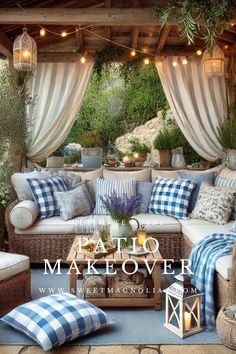 an outdoor living room with blue and white plaid pillows, wicker furniture and curtains