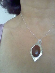 "this beautiful red carnelian is settle on a Silver tear drop hand made with sterling silver, it has a loop that can be used as bail. The stone is 18 x 25 mm and the teardrop is 0.8 mm thick, the chain is 16 inches and 1 mm thick This a special design matches with the carnelian rings that you can see in these links: http://etsy.me/1Tzy0fP http://etsy.me/1TyuVSF *This jewel will be sent to you in a gift box * All the pieces are Hand Made * Custom order We will be glad to make any size, style, oth Amber Teardrop Cabochon Necklace, Polished Teardrop Amber Necklace, Amber Teardrop Necklace With Polished Finish, Red Carnelian Teardrop Necklaces, Elegant Carnelian Oval Pendant Jewelry, Elegant Carnelian Jewelry With Large Pendant, Red Carnelian Teardrop Necklace, Oval Carnelian Jewelry With Polished Finish, Polished Oval Carnelian Jewelry