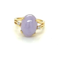 Lavender Jade Ring with Diamonds  This Stunning ring is absolutely magical! The beautiful lavender shade of Jade is just too perfect and the two small diamonds surrounding it really give it that extra sparkle, wow everyone with its beauty. -weight 4.45 gm -Ring size 7.5 -oval lavender jade 13.72x 10mm ring with two 2.0mm .05cttw SI-2H diamond accents -width:13.46/14.42/depth:9.88 shoulder:4.45 shank base:2.01 -13.46x14.4mm across the top, 9.88mm tall shoulders measure 4.45mm tapering to 2.0mm -m Lavender Jade Ring, Lavender Jade, Jade Ring, Rings Statement, Round Diamonds, Statement Rings, Jade, Jewelry Rings, Lavender