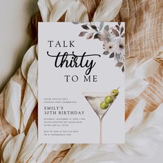 a card with an image of a martini glass and flowers on it, says talk thirty to me