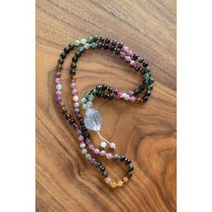 "Daring to set boundaries is about having the courage to love ourselves, even when we risk disappointing others." -Brene BrownTourmaline is a shamanic stone, providing protection during ritual work... or life in general. Multicolored Tourmaline brings the body, mind, and spirit into wholeness. This 108 bead gemstone mala can be used traditionally to give one direction. Each bead is meticulously placed for the most lovely effect. You can order this mala with or without a tassel and adjustable. The adjustable one can be worn as a necklace or as a bracelet (see photos)Stones in this mala:*6mm Tourmaline is the stone of protection and guidance.*Tibetan Quartz Crystal is the ultimate healing crystal.-Ethically sourced high-end stones, cut and polished in small, family-owned factories paying liv Mala Necklace Design, Holistic Healing Crystals With Natural Stones, Multicolor Spiritual Healing Crystals, Multicolor Healing Crystals, Handmade Multicolor Healing Crystals, Spiritual Healing Natural Stone Crystals, Handmade Spiritual Crystals For Meditation, Multicolor Spiritual Gemstone Beads Crystals, Holistic Natural Stones Crystals For Meditation