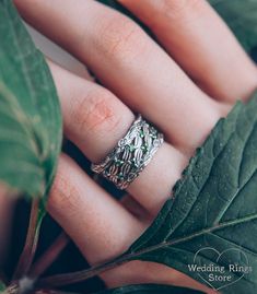 This silver ring combines nature and artistry. It design features scattered emeralds on intertwined branches. It's the perfect jewelry gift for him. Green Promise Rings With Nature-inspired Style, Nature-inspired Green Emerald Ring For Anniversary, Nature-inspired Emerald Ring For May Birthstone, Nature-inspired Emerald Jewelry For Anniversary, Nature-inspired Green Emerald Anniversary Ring, Nature-inspired May Birthstone Jewelry For Anniversary, Green Nature-inspired Promise Rings, Nature-inspired Green Jewelry For Promise, Nature-inspired May Birthstone Jewelry