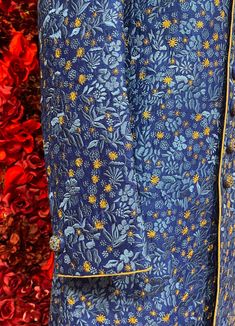 A regal blue sherwani adorned with intricate floral embroidery in gold and silver tones. The high-collared design and detailed buttons exude sophistication, making it perfect for weddings and grand celebrations. The luxurious fabric and rich embroidery make this sherwani a statement piece for any groom or special occasion. Key Features: Color: Royal blue with gold and silver floral embroidery. Design: High-collared with ornate buttons. Fabric: Rich, textured fabric for a luxurious feel. Occasion Royal Sherwani With Zari Work For Festive Occasions, Royal Festive Sherwani With Zari Work, Royal Fitted Kurta For Festive Occasions, Royal Festive Kurta For Eid, Elegant Blue Nehru Jacket With Dabka Work, Royal Blue Traditional Wear For Formal Occasion, Royal Blue Traditional Wear For Formal Events, Royal Blue Fitted Kurta, Designer Blue Sherwani With Dabka Work