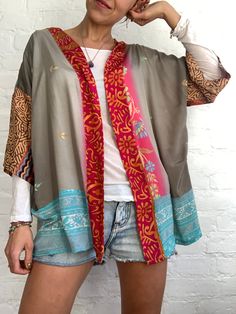 "This is one of kind oryginal and stylish patchwork shirt, unisex oversized topper  true hippie boho style made of upcycled silk, flowy breathable and light perfect fun and party summer top, with wide kimono sleeves, made loose, funky colourful perfect for holidays,  easy to wear on its own or layered over fits all sizes S-XL chest meaesure 52\" more available at  https://www.etsy.com/shop/AltheaStores? Thank you for looking" Patchwork Outfit, Funky Shirt, Free Size Blouse, Open Front Top, Funky Shirts, Upcycled Clothes, Patchwork Shirt, Party Summer, Kimono Sleeves