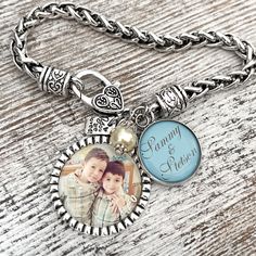 a necklace with an image of two children and the words family is forever on it