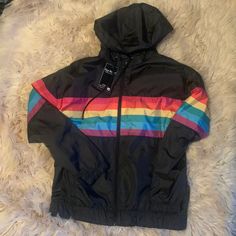 Happy Pride Month Rainbow Jacket Black Medium Trendy Multicolor Hooded Windbreaker, Trendy Rainbow Outerwear For Fall, Trendy Black Fall Windbreaker, Rainbow Long Sleeve Winter Outerwear, Trendy Black Hooded Windbreaker, Black Hooded Trendy Windbreaker, Retro Black Track Jacket With Pockets, Retro Black Hooded Track Jacket, Trendy Black Hooded Track Jacket