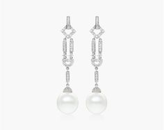 The 18K White Gold Diamond and Cultured South Sea Pearl Art Deco Drop Earrings are a beautiful and unique pair of earrings that are perfect for anyone looking for a stylish and elegant piece of jewelry. The earrings feature a pair of 11-12mm South Sea pearls that are set in a geometric Art Deco design. The pearls are surrounded by glistening diamonds that add a touch of luxury to the piece. The earrings are made of high-quality materials and are sure to last for years to come. The earrings are a Luxury White Earrings For Evening, Luxury White Evening Earrings, Refined White Earrings For Formal Occasions, Luxury Pearl Dangle Earrings For Formal Occasions, Refined White Earrings For Evening, Luxury White Drop Bridal Earrings, White Luxury Bridal Earrings For Pierced Ears, Art Deco Drop Earrings, Pearl Art