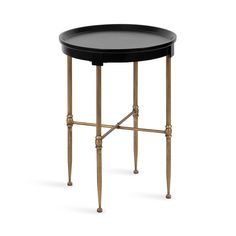 a black and gold side table with metal legs