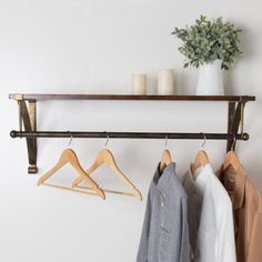 This innovative piece combines a clothing rod and floating shelf, offering ample storage and display space. Enhance your walk-in closet, bedroom, bathroom, or entryway with additional storage options. The wall brackets are designed for easy mounting on any flat surface. Crafted from solid Paulownia wood boards and powder-coated metal brackets, this floating shelf is a fantastic selection for showcasing collectibles, small plants, stuffed animals, and more, adding a touch of elegance and function Paulownia Wood, Wood Boards, Hanging Bar, Bathroom Refresh, Store Ideas, Bathtub Accessories, Display Shelf, Floating Shelf, Closet Bedroom