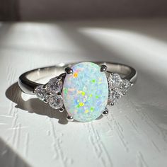 Unique Luxury Oval Opal Ring made with sterling silver. A very Pretty, dainty, and vibrant statement ring. Perfect for everyday wear.  Material: Solid 925 Sterling Silver. Tarnish free. Oval Opal Ring, October Birthstone Ring, October Birthstone Rings, Ring Opal, October Birthstone, Opal Ring, October Birth Stone, Birthstone Ring, Opal Rings