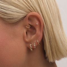 Why settle for just one look when you can have them all? The Tobias earring set is your ticket to endless styling possibilities. With its perfectly matched left and right options, you can follow the rules or mix it up to create your signature style. Created with a sterling silver base and utilizing luxury 14 karat gold plating, this Adorn Luxe hoop earring set can be enjoyed season after season. Earring Sets For Multiple Piercings Gold, 3 Earrings Piercing Ideas, Ear Piercings Placement Ideas, Pretty Ear Piercings Classy, Earring Stacks, 3 Ear Piercings, Pearl Earring Set, Pearl Statement Earrings, Pretty Ear Piercings