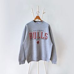 90s Chicago Bulls NBA sweatshirt/ L * PLEASE READ BEFORE PURCHASE * PLEASE consider the PHOTOS before making the decision * The images may DIFFER in appearance from the actual product because we took pictures under daylight.  * PLEASE send your PHONE NUMBER after your purchase for the shipping company to contact you X No returns X No refund Condition : 9/10 More details : scratched (sleeve)/ look at the pictures  Brand : Pro player Size : L Pit to pit/ Chests : 23.5/47 inches  Length : 29.5 inch Throwback Crew Neck Sweatshirt For Streetwear, 90s Style Sweatshirt For Fall Sports Events, Oversized Throwback Sweatshirt For Streetwear, Oversized Throwback Sweatshirt For Winter, Winter Oversized Throwback Sweatshirt, Oversized Winter Throwback Sweatshirt, 90s Style Relaxed Fit Sweater For Streetwear, Oversized Throwback Sweatshirt For College, Letter Print Sweater For Streetwear During Sports Season