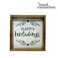 a wooden frame with the words happy holidays in green lettering on it and an image of holly