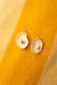 These surprisingly lightweight earrings are the perfect choice for any sea-loving human in your life! Finished with small, raw, white pearls for that last magical touch. Wear these lil' beauties with any outfit, dressed up or down, and bring the salty Salish Sea wherever the wind takes you. And be sure to check out the other shell earrings on my page! Summer Pearl Earrings For Pierced Ears, Summer Pearl Earrings, Summer Gift Pearl Earrings With Ear Wire, Summer Gift Pearl Earrings Shell-shaped, Summer Gift Pearl Shell-shaped Earrings, Summer Gift Shell-shaped Pearl Earrings, Summer Shell Shaped Pearl Earrings For Gifting, Shell-shaped Pearl Earrings For Summer Gifts, Summer Gift Pearl Earrings In Shell Shape