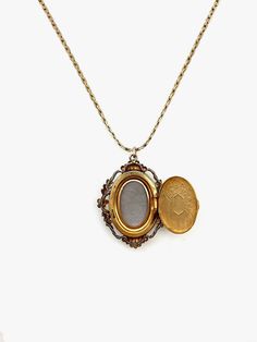 Indulge in timeless elegance with this rare antique cameo locket. Crafted in 12k gold-fill, this exquisite piece exudes charm and nostalgia. The oval shape, measuring 1.5 cm in width and 2 cm in length, showcases meticulous craftsmanship, featuring a detailed carved cameo and etched floral back. Stamped Van Dell, indicating the piece is from the 1940s, and made in Rhode Island. This vintage gem is not just a locket; it's a piece of art that transcends eras. The secure click-shut mechanism ensure Keepsake Yellow Gold Filigree Jewelry, Elegant Filigree Jewelry For Keepsake, Formal Yellow Gold Filigree Locket Necklace, Victorian Yellow Gold Oval Jewelry, Victorian Yellow Gold Oval Cabochon Jewelry, Victorian Oval Yellow Gold Jewelry, Heirloom Style Brass Medallion Jewelry, Heirloom Brass Medallion Jewelry, Vintage Rose Gold Jewelry With Intricate Design