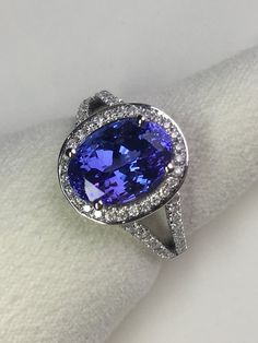 4.02 carat Natural Tanzanite and 0.44 carats Natural Diamonds | Etsy Tanzanite Rings, Birthstone Engagement Rings, Tanzanite Diamond Ring, Tanzanite Diamond, Fancy Rings, Natural Diamond Ring, Tanzanite Ring, Shades Of Gold, Gold Halo