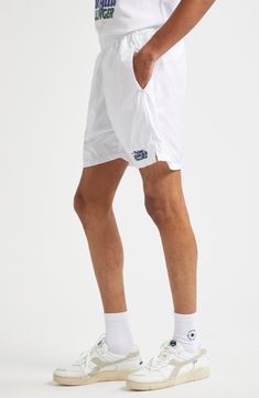 Serve your best style game on and off the court in these sporty tennis shorts equipped with side-seam pockets that hold three tennis balls each. This piece is part of a Nordstrom-exclusive capsule that pays tribute to two former tournament sites—Newport Casino and Forest Hills. Elastic waist Side-seam pockets 100% polyester Machine wash, line dry Made in Portugal Designer Clothing White Nylon Athletic Shorts With Built-in Shorts, White Nylon Shorts For Streetwear, White Sports Shorts With Short Inseam, White Athletic Shorts With Short Inseam For Sports, White Athletic Shorts For Sportswear, Sporty White Shorts With Short Inseam, White Nylon Athletic Shorts With Built-in Liner, White Moisture-wicking Nylon Shorts, White Tennis Sportswear Bottoms