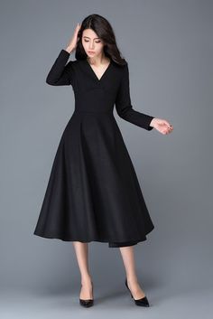 It is a wool blend dress, it has a polyester lining V collar Side hidden zipper Has no pockets   Shop sizing chart FYI ( made according to US sizing. actual body figures, NOT laying flat clothes measurements)  SIZE (US 0, UK 4, Italian 34, French 32, German 30, Japan 1) bust: fits bust around 32.5” / 82.5cm Waist: fits waist around 25” / 64cm Hips: fits hips around 35” / 89cm For overall height: 52 / 157cm around  SIZE (US 2, UK 6, Italian 36, French 34, German 32,) bust: ... Winter Evening A-line Midi Dress, Fitted Long Sleeve A-line Dress For Winter, Fitted A-line Long Sleeve Winter Dress, Elegant A-line Winter Maxi Dress, Classic Black A-line Maxi Dress, Winter A-line Solid Color Maxi Dress, Winter Evening Maxi Dress With V-neck, Elegant Formal V-neck Dress In Solid Color, Fall A-line Cocktail Dress