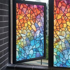 two stained glass windows are open on the outside