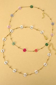 Summer Multi-Beaded Flower Charm Necklace, a vibrant accessory to brighten up your look for the sunny days ahead! This exquisite necklace boasts a delightful arrangement of colorful beads intricately woven together, culminating in a charming floral centerpiece. Each bead radiates summer vibes, bringing a burst of joy and style to any outfit. *Matching Bracelet # 40B108* DIMENSIONlength: 15"ext: 3" Ball Chain Extclasp: Lobster Clawmetal finish: Gold Platedproduct: Lead & Nickel Compliantanti-tarn Album Inclusions, Outfit Matching, Flower Charm Necklace, Gold Necklace Simple, Floral Centerpiece, Sunglass Chain, Summer Necklace, Square Pendant, Matching Bracelet