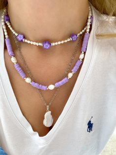 Three different boho summer necklaces with purple flowers, purple beads and freshwater pearls in different sizes and shapes. Combine them all together or wear them separetely as well. In Christina Christi Jewels store you can see more than 50 designs in Women's Necklaces. You can have them in 2-4 Days with DHL EXPRESS SHIPPING MATERIALS - Caoutchouc Beads. - Freshwater Pearls. - Stainless Steel Chain in Silver Color. - Metal Parts. - Adjustable Necklaces DIMENSIONS - Purple Flowers Necklace has Beach Jewelry With Colorful Purple Beads, Purple Jewelry With Colorful Beads For Beach, Summer Gift Purple Beaded Necklaces, Summer Purple Beaded Jewelry, Handmade Purple Beaded Necklace For Summer, Summer Purple Beaded Necklaces With Colorful Beads, Summer Purple Beaded Necklace With Colorful Beads, Handmade Purple Beaded Necklaces For Beach, Handmade Purple Necklaces For Beach