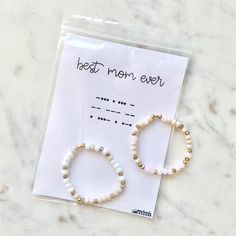 Best mom ever Morse code bracelet for a gift or Mother’s Day1. Choose your size2. Tell me the two colors you want in NOTES TO SELLER when purchasing (and if you have a preference on which is the dot and which is the dash)3. Leave any special notes in the notes section when you purchase. Feel free to ask me anything prior to purchasing.*Feel free to ask if you want something else in Morse Code. As long as the length of what you want to write does not make the bracelet too long for the size you ne Hypoallergenic Beaded Bracelets For Mother's Day Birthday Gift, White Beaded Bracelets For Mother's Day Birthday, White Friendship Bracelets For Mother's Day, Dainty Friendship Bracelets For Mother's Day, Dainty Beaded Bracelets For Mother's Day Friendship, Minimalist Beaded Bracelets For Mother's Day Gift, Mother's Day Birthday Gift Friendship Bracelets With Letter Beads, White Letter Beads Friendship Bracelet For Birthday, White Dainty Bracelet For Birthday Gift