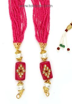 Magenta color layered seed Beads Dori - Tassel for Pendants 
  Length of the beads dori : 16.0 inches + adjustable upto 24 inches
  This item is NOT made of Gold
  This item does NOT have any Gold in it
  Use this dori - Tassel to attach it to pendants
  The dori - Tassels come with detachable hooks on each side, so it is very easy to clip it on to any pendant. 
  Add this to your favorite pendant to enhance its beauty. These will look awesome with our Temple Jewelry Pendants. 
  Buy these in va Traditional Pink Adjustable Beaded Necklaces, Traditional Adjustable Pink Beaded Necklace, Traditional Pink Beaded Necklaces, Traditional Pink Necklaces With Colorful Beads, Traditional Pink Jewelry With Tiny Beads, Traditional Pink Beaded Necklace, Traditional Pink Beaded Necklaces For Festive Occasions, Festive Pink Necklace With Latkans, Pink Beaded Necklace With Polished Beads For Festivals