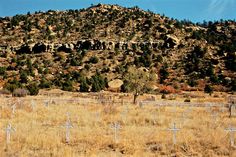 a hill with crosses in the middle of it