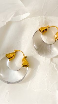 Modern Round Lucite Jewelry, Gold Lucite Earrings As A Gift, Gold Lucite Earrings For Gifts, Modern Small Hoop Jewelry In Clear, Modern Clear Hoop Earrings For Pierced Ears, Modern Clear Hoop Earrings, Modern Small Hoop Clear Jewelry, Modern Clear Small Hoop Jewelry, Elegant Clear Resin Earrings