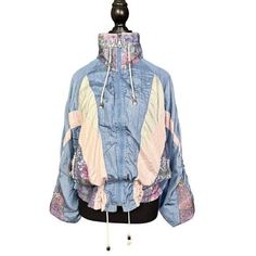 Good Vintage Condition - Regular Wear Consistent with Age Embrace the retro vibes with this vintage 90s windbreaker jacket, featuring a stylish colorblock design in pastel shades of blue, pink, and cream. This medium-sized jacket is perfect for those who love to add a touch of nostalgia to their wardrobe. The lightweight fabric and drawstring details make it an ideal choice for breezy days and outdoor adventures. - Size: Medium - Color: Blue with pink and cream accents - Material: Lightweight ny Pink Windbreaker, 90s Windbreaker, 90s Retro, Pastel Shades, Spring Jackets, Patchwork Designs, Windbreaker Jacket, Lightweight Jacket, Outdoor Adventures