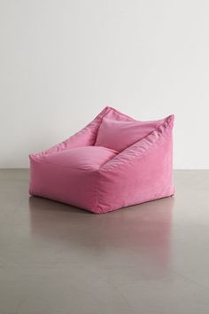 Instantly elevate your reading nook with the coziest bean bag chair with a plush velvet cover and supportive bead fill. Features a boxy silhouette for a modern look we love. This custom furniture piece will be made to order just for you. Features Cozy bean bag chair Plush velvet cover Bead filling offers a supportive seat Boxy silhouette adds a modern flair Made to order just for you Content + Care Arrives fully assembled Polyester; polystyrene beads Spot clean Made in the USA Size Dimensions: 33" l x 34" w x 27" h Interior seat dimensions: 20" l x 22" w x 13" h Weight: 20 lbs Shipping package dimensions: 36.25" l x 35.75" w x 31.25" h Shipping package weight: 24 lbs | Cooper Velvet Bean Bag Chair in Pink at Urban Outfitters Comfy Bean Bag Chairs, Cool Bedroom Chairs, Cool Room Things, Cozy Seating Area In Bedroom, Bean Bag Chair Aesthetic, Seating In Bedroom, Cozy Bedroom Chair, Pink Bean Bag Chair, Comfy Bedroom Chair