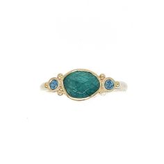 Originally discovered in Madagascar this unique stone is gaining in popularity due to its scarcity and its stunning coloring. Set in 14k yellow gold with a handmade sterling silver seagrass band we accented it with glowing blue zircons. Approximate stone size: 8mm x 6mm Approx TCW: 1.5cts Mohs hardness: 7.5 This one of a kind piece is handmade with love in Emily's Hudson Valley studio. If you have questions about sizing, shipping or need help deciding please reach out to us! Blue Zircon Ring, Colored Stone Engagement Rings, Stacked Engagement Ring, Coloring Set, Local Jewelry, Zircon Ring, Diamond Shop, Stone Engagement Rings, Blue Zircon