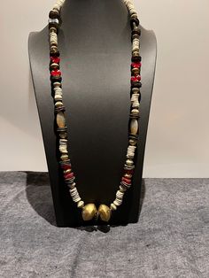 "LATIFAH:  Long necklace, ethnic, red and creamy white, African and premium Picasso Czech beads.  Conversation starter.   Wonderful details. Beautiful bronze cornflake spacers, Czech striped bicones in cream and transparent colors.  I wanted this necklace to be on the earthy side with unique changes in pattern as design travels towards the head . . .  hearts near the face.  It was a challenge to get this \"right.\"   Hope you enjoy it." Bohemian Long Necklace With Wooden Beads, Bohemian Beige Necklace With Wooden Beads, Bohemian Beige Necklaces With Wooden Beads, Beige Bohemian Long Necklace, White Bohemian Beads For Festive Occasions, Bohemian Beaded Necklace With Large Beige Beads, Bohemian Cream Jewelry With Wooden Beads, White Bohemian Necklaces For Rituals, Bohemian Beige Beaded Necklace With Large Beads