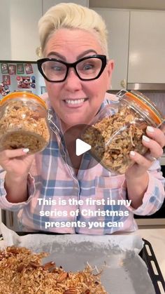 a woman is holding up some granola in front of her face and the caption reads, this is the first in my series of christmas presents you can