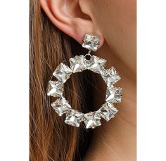 You deserve to be a princess for your day. ⬇️ Shipping takes; 2-4 days to USA 1-3 days to EU 2-5 days to rest of the world. PRODUCT DESCRIPTION👇 These Jewelry Furtek earrings are the epitome of fashion and style. Their combination of crystal stone and rhinestone creates a stunning look that is both trendy and elegant. The crystal stone sparkles in the light, adding a touch of sophistication to your outfit. The rhinestones are strategically placed to enhance the overall design, creating a piece Party Hoop Earrings With Sparkling Stones, Crystal Hoop Earrings For Party, Diamond White Pierced Party Earrings, White Diamond Pierced Earrings For Party, Single Diamond White Earring For Party, Crystal Hoop Earrings For Wedding, Dazzling Hoop Earrings For Party, Dazzling Pierced Diamond Earrings For Party, Wedding Crystal Hoop Earrings