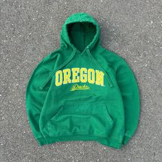 Y2k Oregon Ducks Hoodie Pullover Sweater Size Tag Is Missing, But Fits Like A Mens Us Size Large - Xl. Super Clean Green And Yellow Color Way With The Fat Laces Drawstrings. Big Oregon Ducks Front Hit. Used, But In Great Condition. See Pictures For Details. Ask Any Questions Before Purchasing. All Sales Are Final. Green Hooded Sweatshirt For College, Green Hooded Top For College, Varsity Green Hoodie For Fall, Green Varsity Hoodie For Fall, Green Varsity Hooded Sweatshirt, Green Cotton Varsity Hoodie, Yellow Hoodie For Winter Streetwear, Urban Green Sweatshirt For College, Green Urban Sweatshirt For College